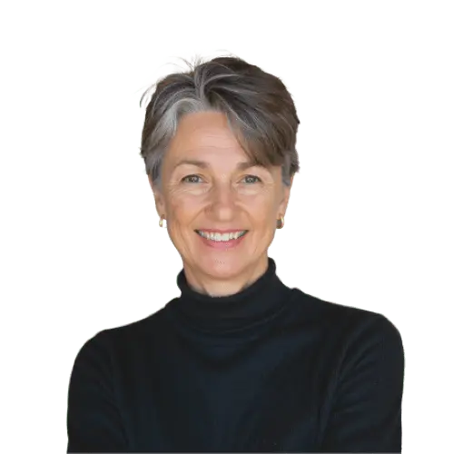 Person smiling at the camera in a black turtleneck.