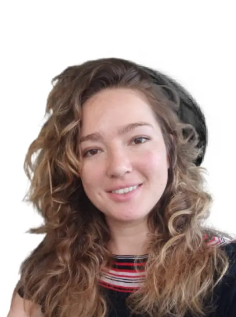 Kelsey, team member at Bidbuddy, smiling with long curly hair in a casual portrait.