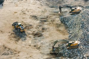 Aerial view of construction site used as featured image for article: Why Every Business Needs a Tender Writer in 2024.